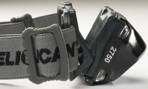 Close-up of 2750C LED Headlamp, showing adjustable grey strap and LED light, compact 2.25 inch design for outdoor adventures.