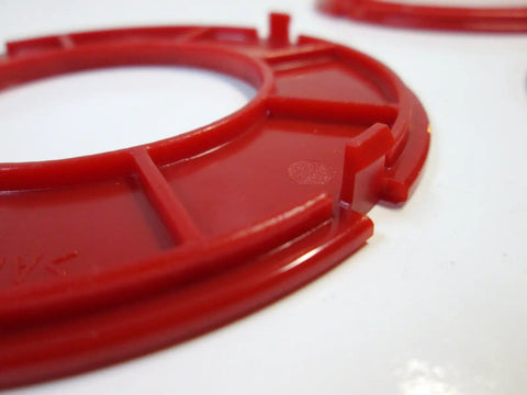 Close-up of precision router table insert ring set featuring workhorse grade 97 millimeter diameter heavy duty aluminum.