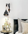 Vintage Industrial Wheel Pulley Wall Mount Lamp Set Of 2 with plug in 7 foot brown cord above bedside table.
