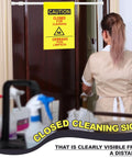 Double Sided Restroom Closed For Cleaning Sign With Telescopic Stand And High Viz Yellow Panel Bilingual English Spanish Floor Board For Quick No Sweat Setup And Everyday Janitorial Jobs on a door.