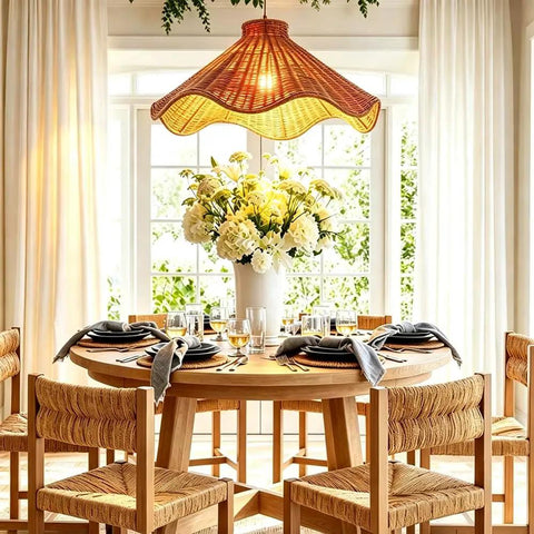 YUJIDAO 19.7 Inch Rattan Chandelier above a dining table, featuring boho design, hand-woven material, and flowers.