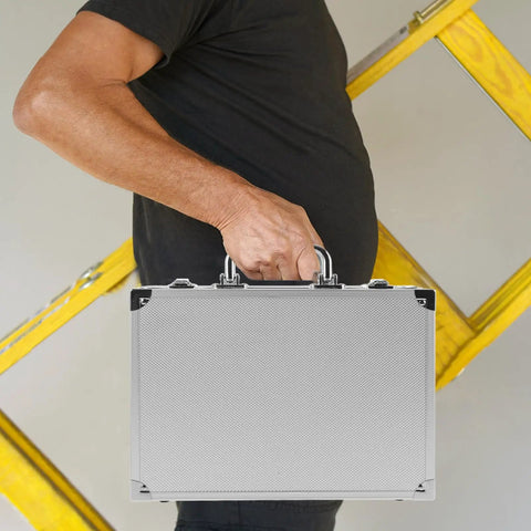 No Sweat Rolling Aluminum Toolbox With Handle Compact Storage Suitcase Heavy Duty Hard Shell Carry Case Built For Tools Portable Gear Crate held by a person next to a ladder.