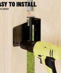 Installing Heavy Duty 3.5 Inch Gate Hinges With Extra Thick Straps using a drill on wood barn door, black finish