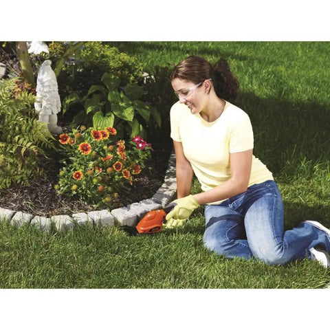 Person using Cordless Shrub Trimmer And Grass Shear Combo, Lightweight Three Point Six Volt Lithium Battery, Easy Grip, Low Emission Yard Tool for edging