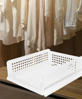 Straight Up Sleek White Plastic Foldable Storage Basket Pull Out Wardrobe Drawer Organizer For Clothes Books Makeup Nifty Space Saver Bin That Kicks Clutter To The Curb Fast on a wooden shelf near hanging shirts.