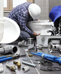 Plumber installs toilet with tools and fittings, showcasing Two Inch By One And Quarter Inch NPT Female Reducing Coupling 304 Stainless Steel