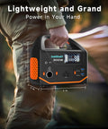 Person holding Portable Power Station 300W 266Wh Solar Generator with 7-output hub, dimensions shown in inches.