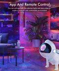 Living room with All In One Star Projector creating space vibe with galaxy projection and ocean wave night light.
