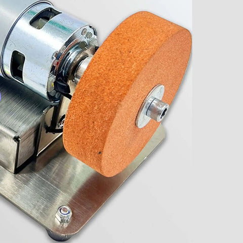 Close-up of Compact Mini Belt Sander With High Power Motor And Adjustable Speed Options From 3000 To 6000 Rpm, showing sanding wheel.
