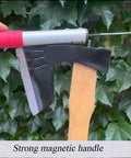 Japanese Weeding Tool With Magnetic Handle shown on a tree branch, featuring SK5 steel blade and soft rubber grip
