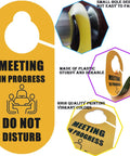 Double-Sided Meeting In Progress Door Sign pack of 2 in yellow PVC with 'Do Not Disturb' and 'Available' text for office use.
