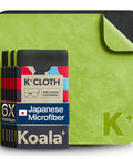 Front view of Koala 6-pack Japanese microfiber lens cleaning cloths, black and green packaging on a lime mat