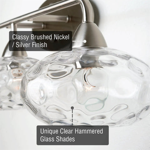 Close-up of 26 Inch Modern Three Light Vanity Light With Hammered Glass Shades In Brushed Nickel Finish Wall Mount
