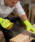 Man using Heavy Duty Micro Foam Nitrile Work Gloves With Hella Breathable 15 Gauge Nylon Shell and Killer Tiger Stripe Grip for sawing wood.