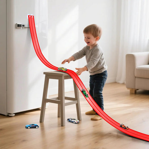 Child playing with Flexible Roll Up Two Lane Race Track For Kid Friendly Play With Suction Cups Includes Four Mini Diecast Cars 1 64th Scale Compatible Indoor Outdoor Portable Racetrack That Rolls Up Easy And Fun For Ages Three And Up, set up indoors with red track on stool.