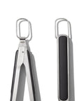 Top view of scalloped tongs from Three Piece Grilling Tool Set With Stainless Steel Turner Scalloped Tongs And Silicone Tool Rest Built In Bottle Opener Non Slip Grip And Tong Holder Designed For One Handed Use With Extra Leverage From A Double Bend