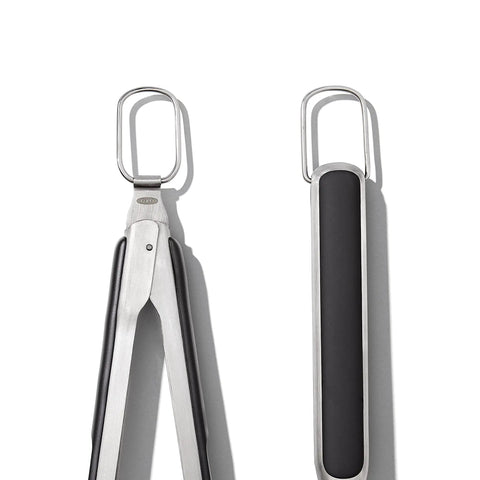 Top view of scalloped tongs from Three Piece Grilling Tool Set With Stainless Steel Turner Scalloped Tongs And Silicone Tool Rest Built In Bottle Opener Non Slip Grip And Tong Holder Designed For One Handed Use With Extra Leverage From A Double Bend
