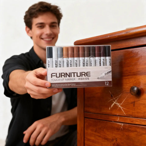 Person holding 12 Color Wood Marker Set For Furniture Repair next to scratched wooden cabinet for touch up of surfaces.