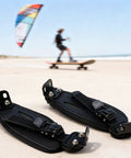 Secure Foot Holder Straps for Electric Scooters and Longboards on sandy beach with kite surfer in background