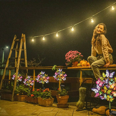 Solar Garden Lights Outdoor 2 Pack With 34 Butterflies And 44 LED Fairy Lights Waterproof Garden Decor displayed on a patio.