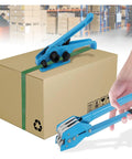 Heavy Duty Strapping Machine With 1000N Tension And 400Kg Break Strength securing a box with a green strap in a warehouse.