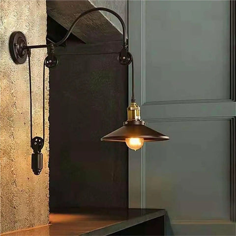 Adjustable Iron Wall Sconce With Smooth Glide Pulley Wheel And Clear Glass Shade For Soft Cozy Ceiling Lighting featuring a sleek design.