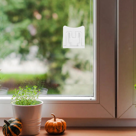 Two Pack Kid Safe Proof Cabinet Locks mounted on a glass window for Kitchen and Home Safety Plastic Drawer Latches that keep cabinets closed.
