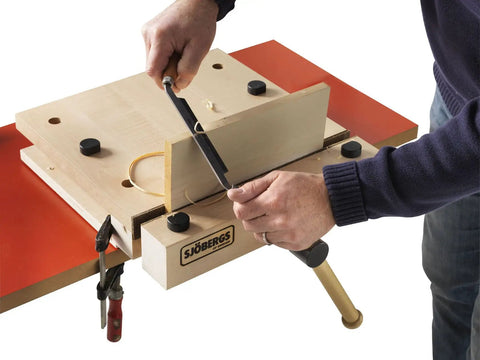 Heavy Duty Portable Woodworking Vise Offering Ridiculous Grip and Chunky MDF Top Slick Design with precision cutting on workbench.