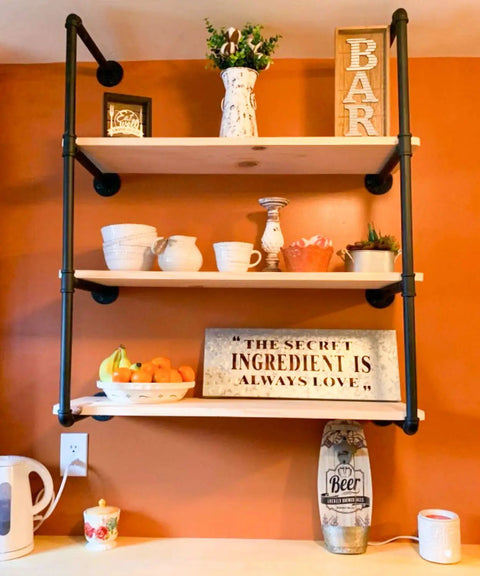 Industrial Pipe Shelving Kit 55 Inch Tall 5 Tier DIY Wall Mounted Iron Pipe Bracket System Matte Black Heavy Duty Shelving in use