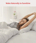 Person waking up in bed with sunlight, promoting Curtain Automation Motor For Smart Home With Wireless App And Auto Timer Control.
