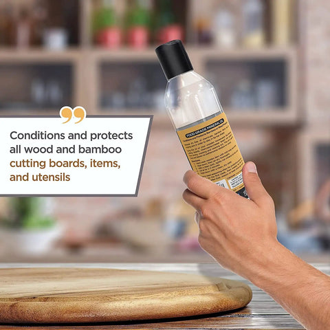 Hand holding Food Grade Mineral Oil For Wood Cutting Boards And Butcher Blocks All In One Food Safe Wood Conditioner bottle
