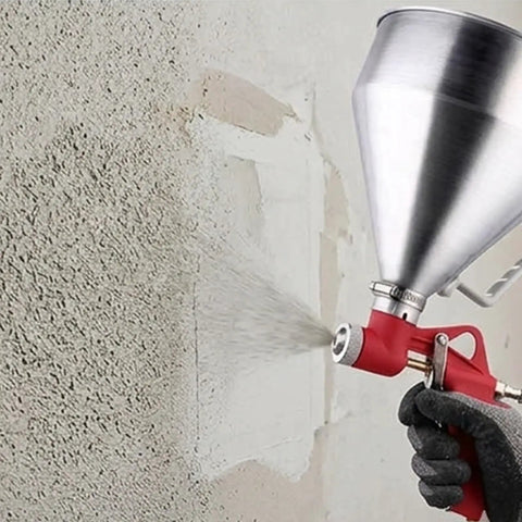 Pro Level Air Spray Gun Kit With Swap Out Three Liter And Six Liter Tanks delivering smooth atomization on a wall surface.