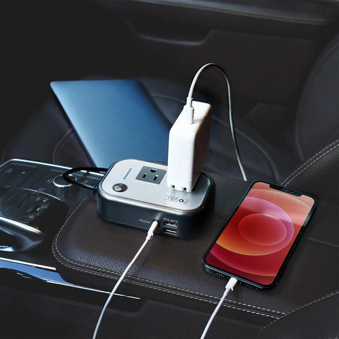 Beast Mode Compact Car Power Inverter Step Up Dc Twelve Volt To One Hundred Eleven V Using Twenty Seven Watt Pd Usb C and Dual USB ports with smartphone charging on a car console.
