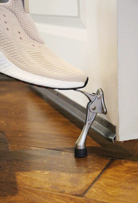 Step On Door Stop Brushed Nickel 1 Piece No Fuss Easy Install Includes Screws With Instant Release No Manual Lift in use