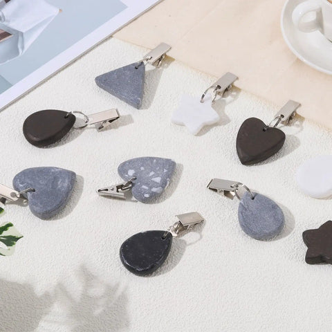 10 Pack Teardrop Tablecloth Weights With No Slip Metal Clips Marble Stone Pendant Weights 4.5x3.5 cm shown on a table