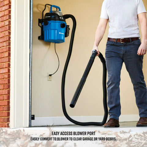 Person using 5 Gallon Wall Mount Wet Dry Vacuum With Remote Control 5 Peak HP Ultra Quiet 2 Stage Motor For Easy Shop And Garage Cleanup For Home Blue Built For Quick Cleanup Power