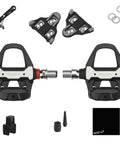 Assioma Pro RS-1 Single Sensing Pedal Based Power Meter for SPD SL, showing both pedals, cleats, and installation accessories.