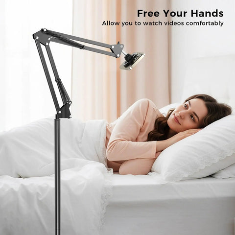 One Second Magnetic Bedside Phone Holder With Adjustable Arm for laying down, shown bedside in use by a woman in bed.