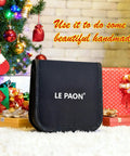 Grab And Go Portable DIY Sewing Kit For Travelers And Beginners with durable black case amidst wrapped gifts by Christmas tree.