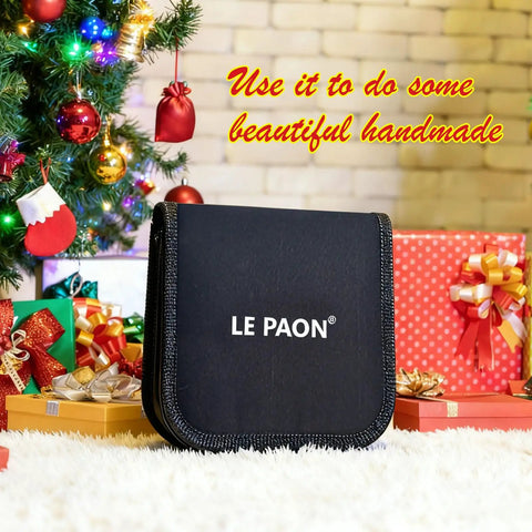 Grab And Go Portable DIY Sewing Kit For Travelers And Beginners with durable black case amidst wrapped gifts by Christmas tree.