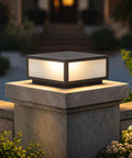 Hella Stylish Modern 15.75 Inch Flat Surface Pillar Lights For Outdoor Porch Deck Post With Romantic Soft Candle Glow Industrial Column Cap Lamp For Sweet Night Vibes And Cozy Patio Decor on a stone pillar.