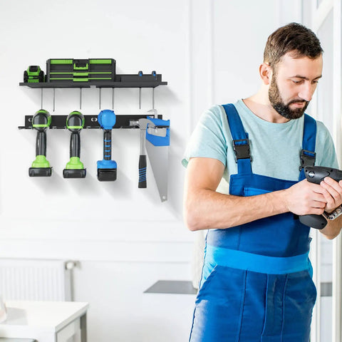 Man uses Power Tool Organizer Wall Mount With Drill Holder And Rack One Shelf And One Drill Rack Garage Ready Heavy Duty