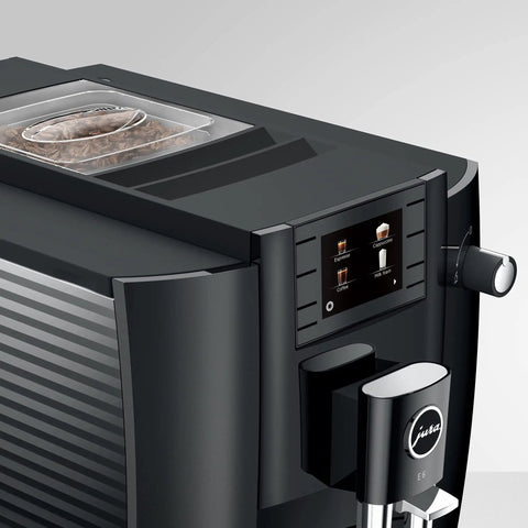 NoDrama Automatic Coffee Machine With OneTouch Espresso Brewing Milk Froth And Rapid SelfClean Design Programmable Strength Volume Controls For Smooth Daily Grinds In Piano Black top view with bean container and control panel.