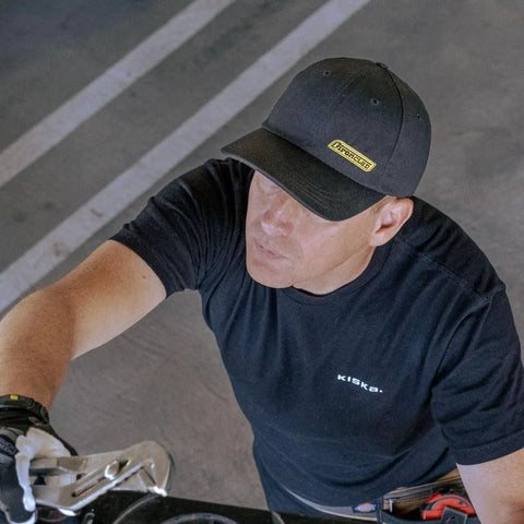 Man wearing Rainier BCX Bump Cap Made In USA With Low Profile Protection And Ball Cap Style Vibe adjusting snap closure.