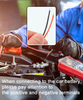 Hand holding 2-Wire CB Power Cable With 3 Pin Plug And 15A Fuse, 59 Inch Long Replacement CB Radio Power Cord near car engine