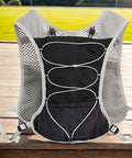 Reflective 5L Hydration Vest For Running And Cycling, Lightweight Quick Drying Breathable Backpack With Adjustable Straps And Multi Pocket Organizer Built For On The Go Trail And Road Training, black vest on wooden surface