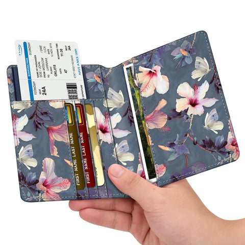 Slim RFID Passport Holder Travel Wallet With Card Slots, Blooming Hibiscus Design in hand; open view with cards and passport.