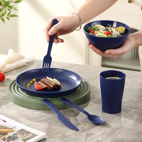 Camping Mess Kit For Two With Plates, Bowls, Cups, Utensils, And Carry Bag And Plastic Camping Essentials in use on kitchen counter