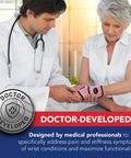 Doctor assisting woman with Wrist Brace For Carpal Tunnel And Tendonitis With Comfortable Hand Support Pink One Pack Great For Fitness And Weightlifting Includes Handy Handbook For Easy Self Care.