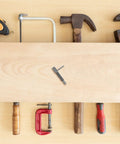 Heavy Duty Retractable Stainless Steel Plunger Pin With Spring Loaded Handle Knob For Drop Dead Solid Cabinet Security Quick Snap Toolbox Latch And Drawers on a workbench surrounded by tools.